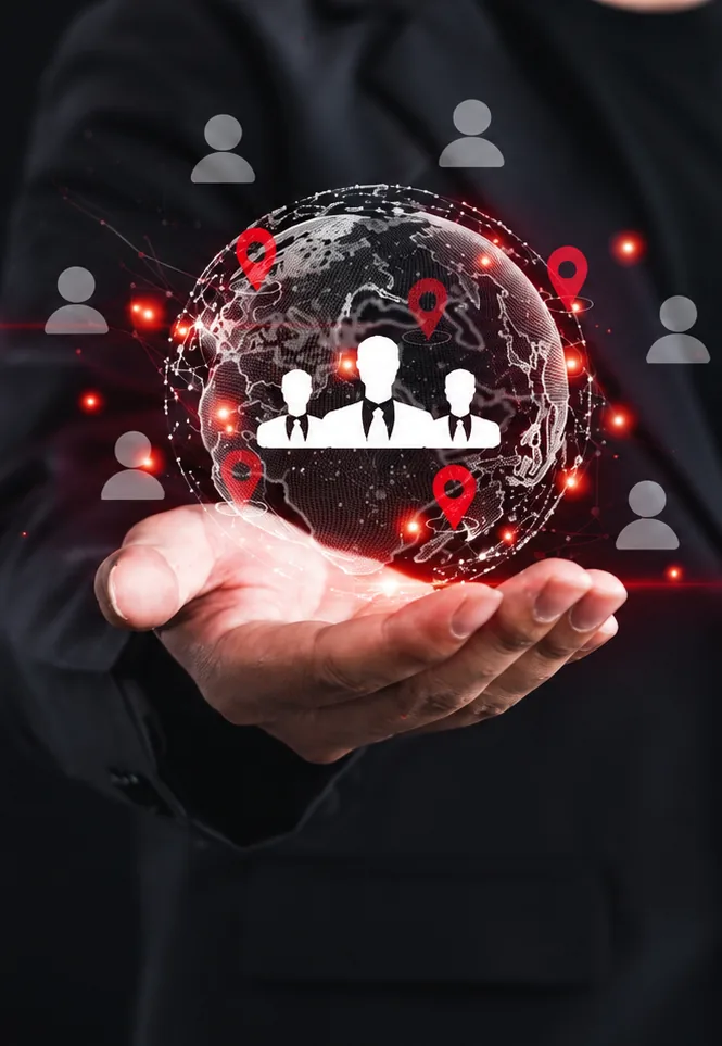 Businessman holding a virtual globe with team icons and location pins representing IT talent placement