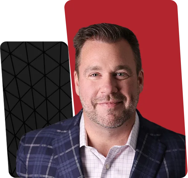 Robert Hessel, Chairman and CEO of Source 1 Solutions, in front of a red and black brand backdrop