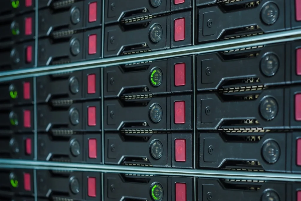 Close-up of hot-swap drive bays with status lights in an enterprise storage array
